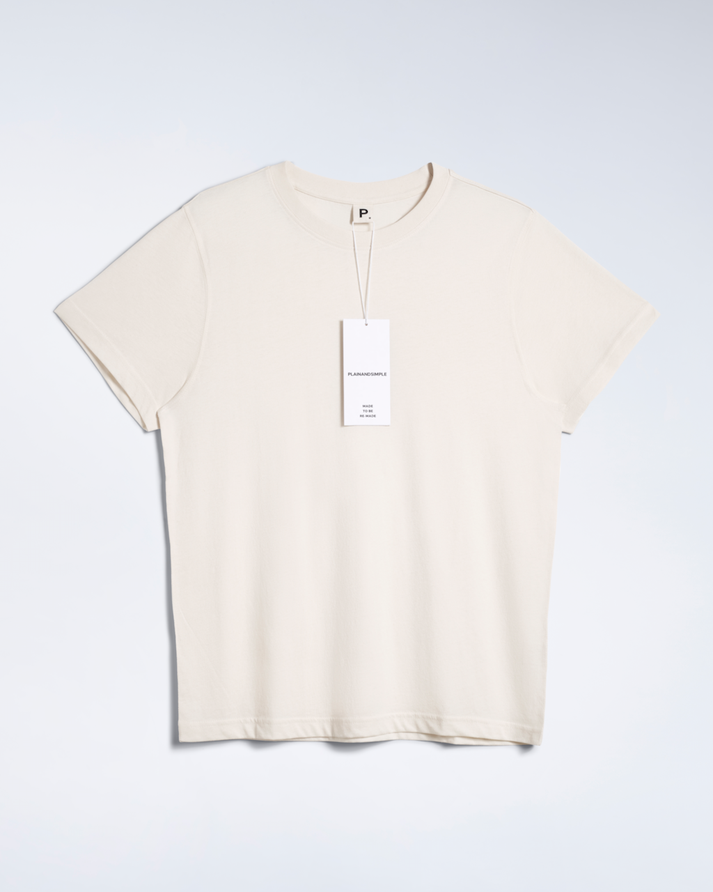 A flatlay of a natural coloured, lightweight, organic cotton t shirt.