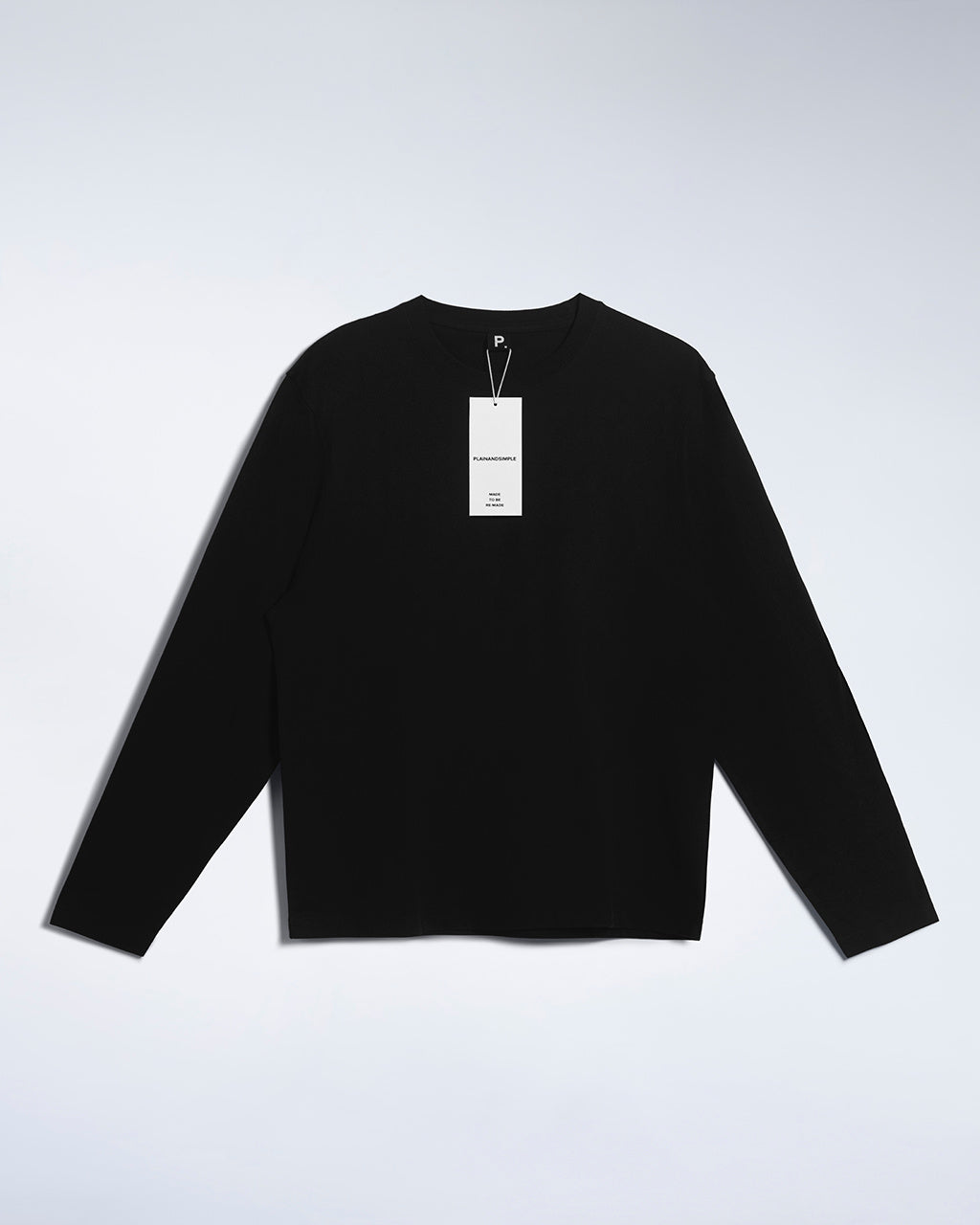 A flatlay of a men's plain black long sleeve crew neck organic cotton t shirt.