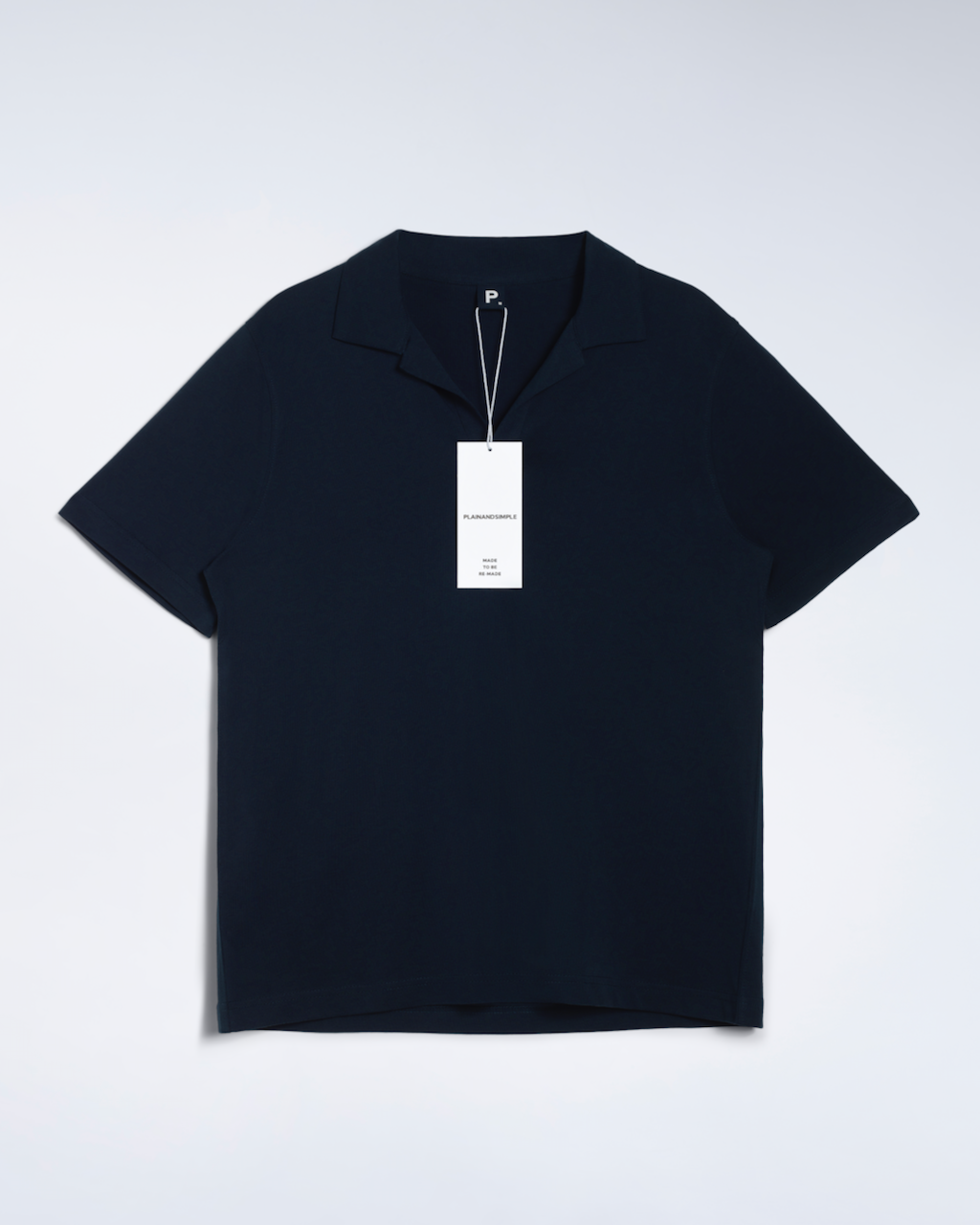 A flatly of a navy, open neck, organic cotton polo shirt.