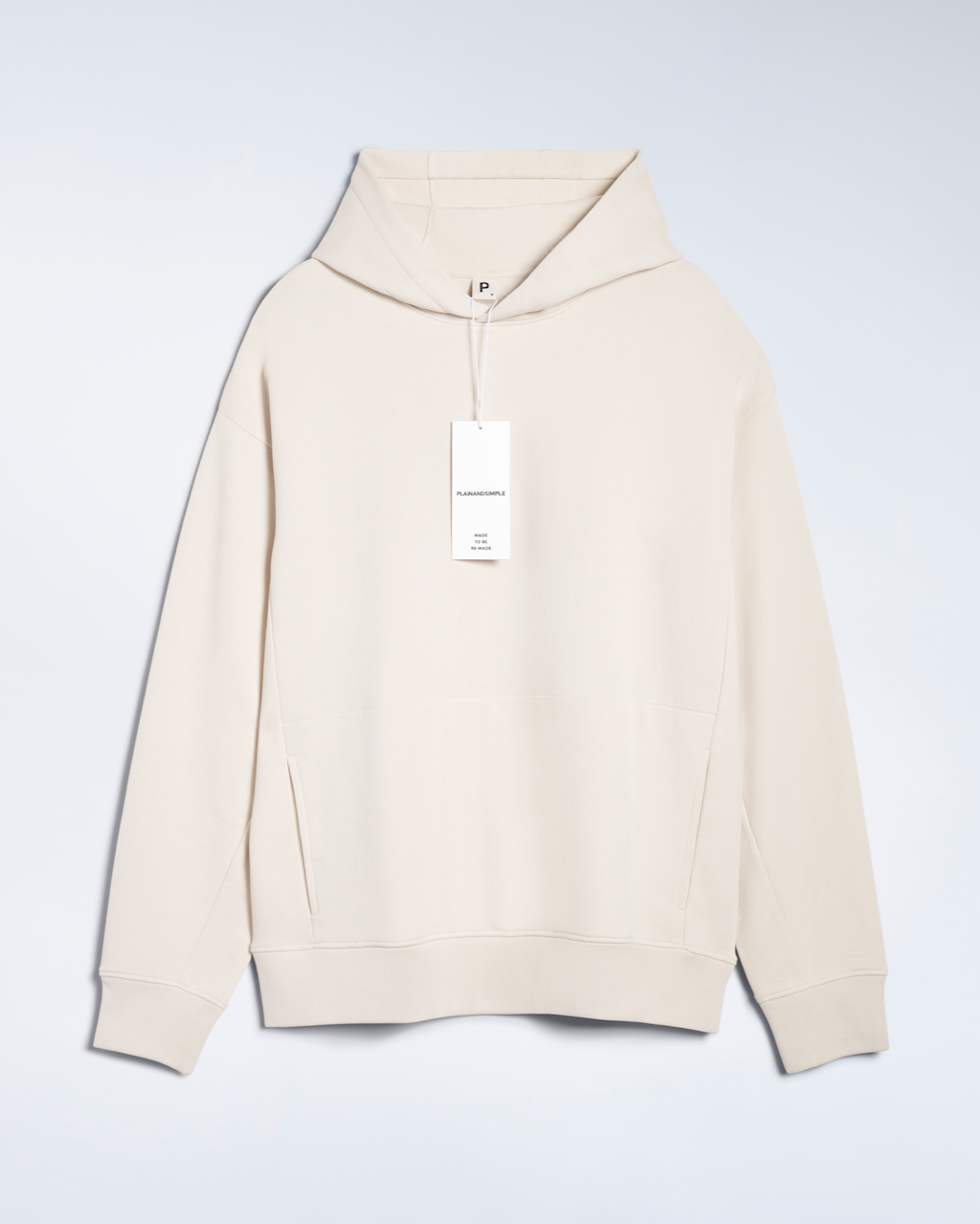 A flatlay of a natural coloured, oversized, organic cotton hoodie.