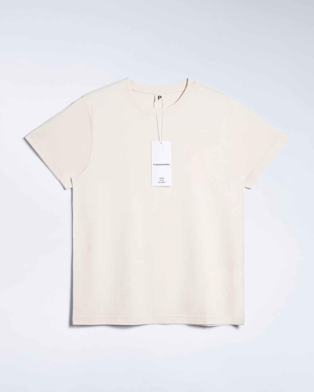 A flatlay of a natural coloured, premium weight, organic cotton t shirt.