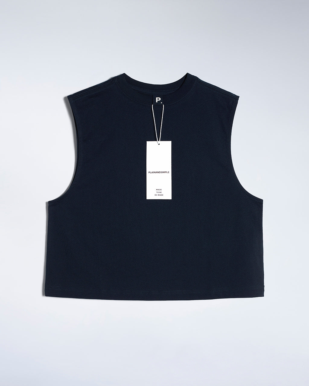A flatlay of a women's plain navy sleeveless organic cotton tank top.