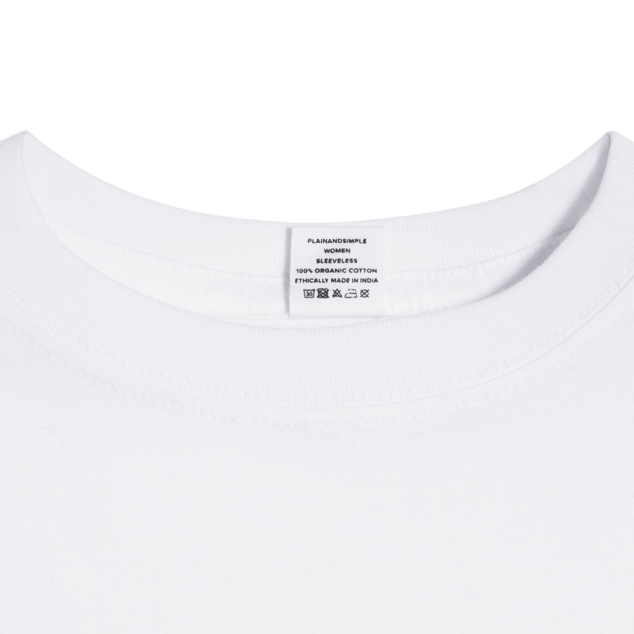 A close up of a neck label in a women's white sleeveless organic cotton crew neck tank top.