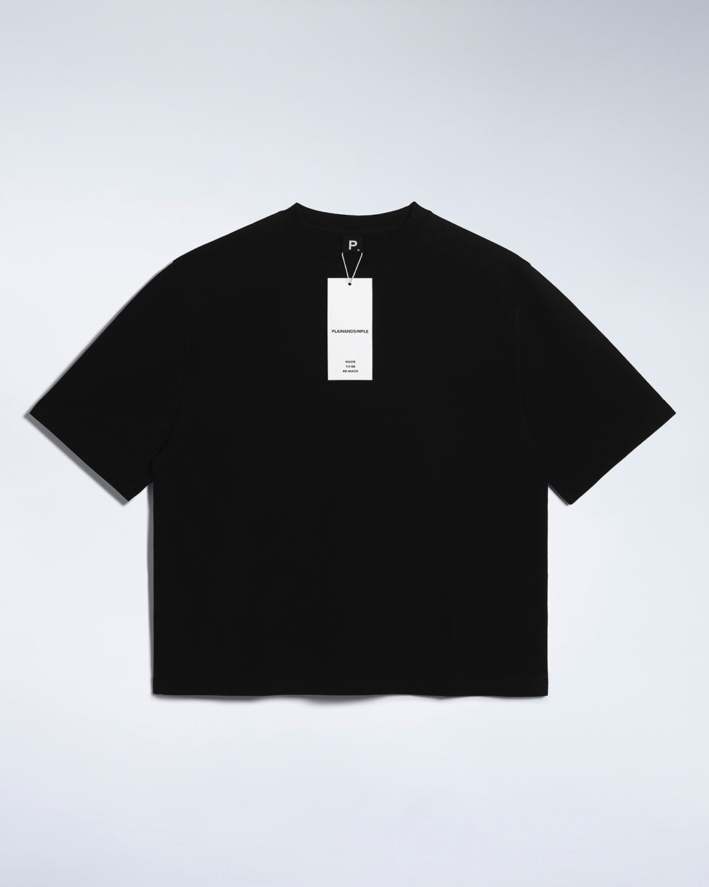 A flatlay of a women's plain black boxy heavyweight organic cotton t shirt.