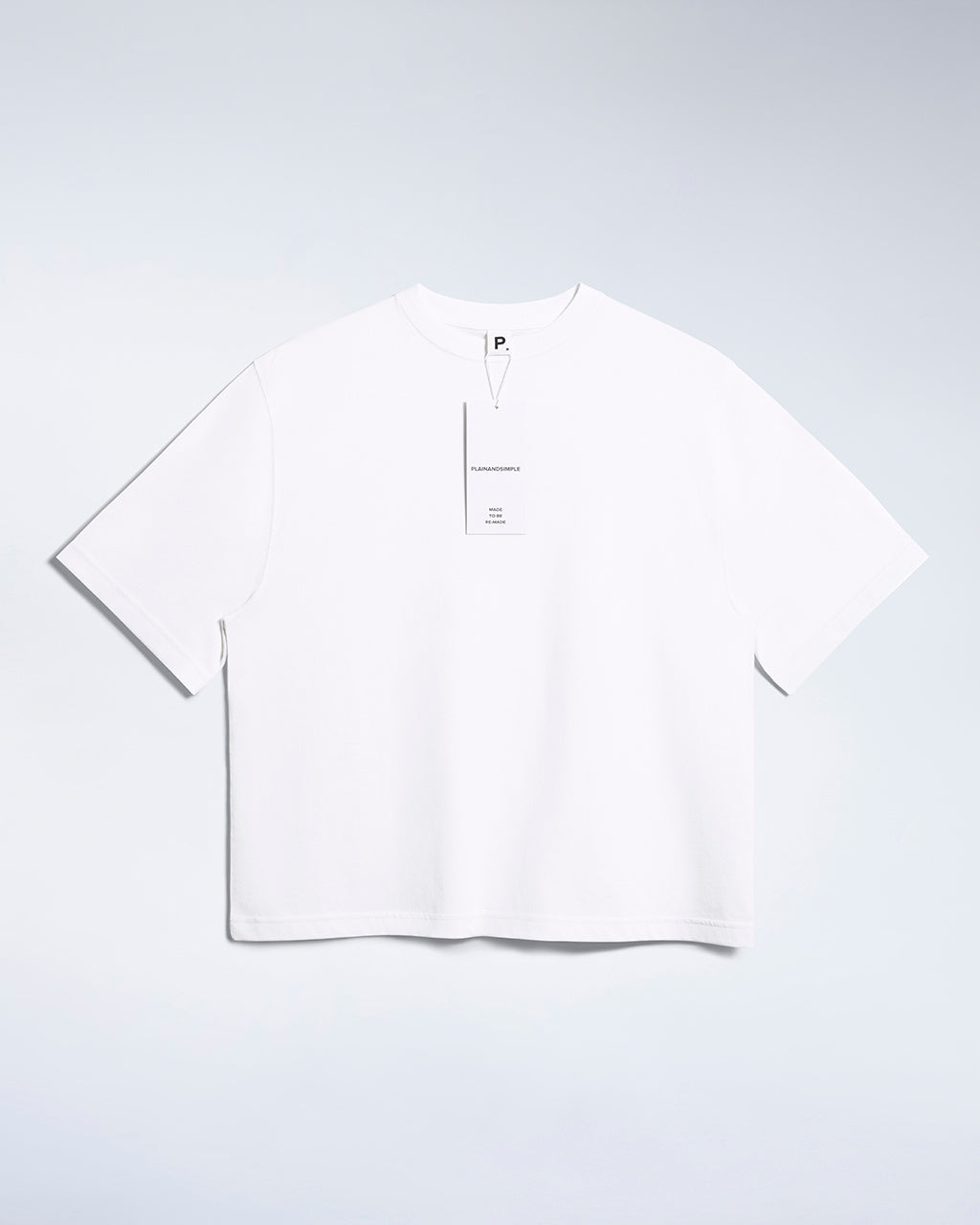 A flatlay of a women's plain white boxy heavyweight organic cotton t shirt.