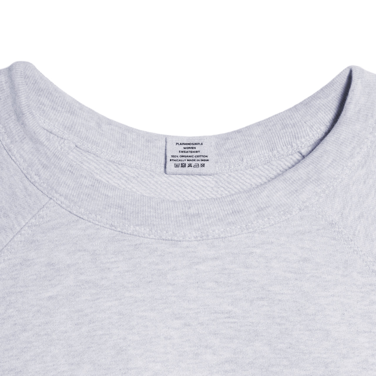 A close up of a neck label in a women's grey heavyweight organic cotton sweatshirt.