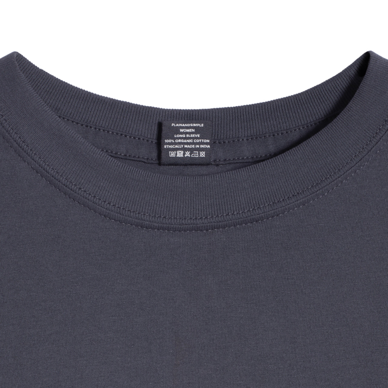 A close up of a neck label in a women's dark grey long sleeve crew neck organic cotton t shirt.