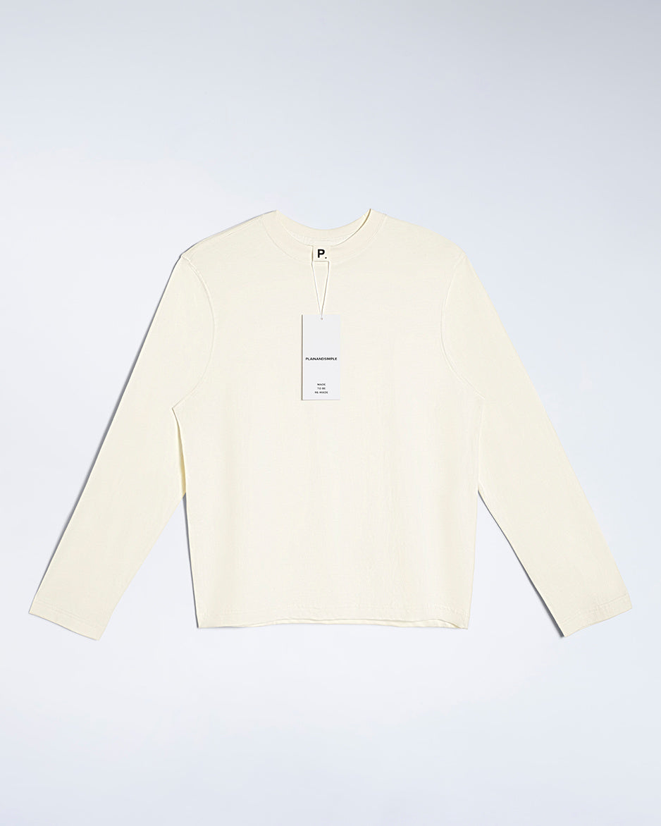 A flatlay of a women's plain ecru long sleeve crew neck organic cotton t shirt.