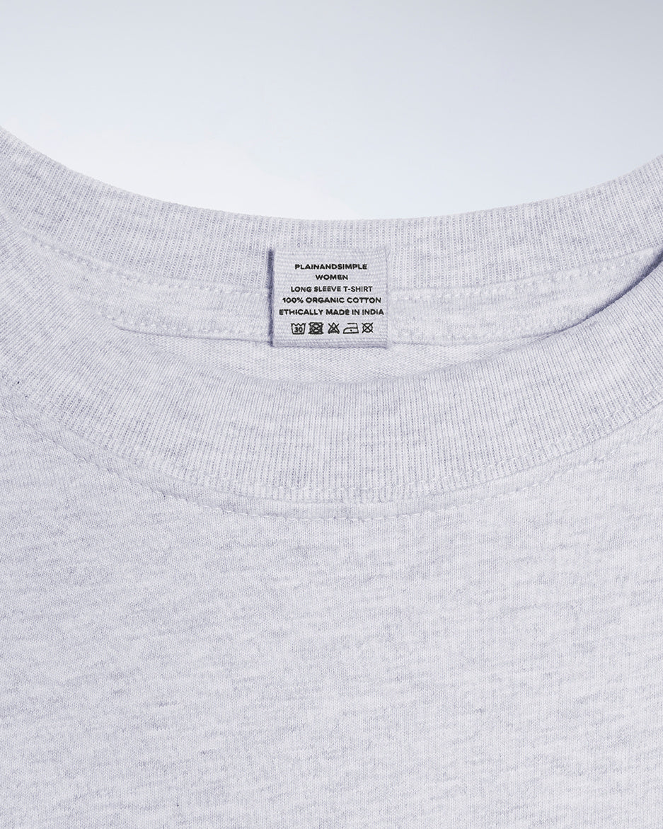 A close up of a neck label in a women's grey long sleeve crew neck organic cotton t shirt.