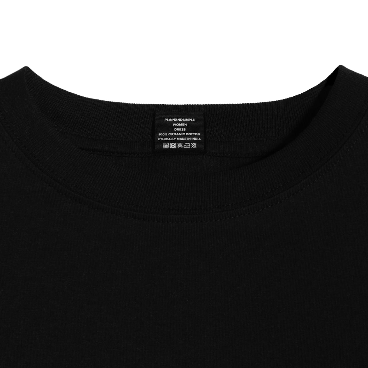 A close up of an neck label in a women's black organic cotton t shirt dress.