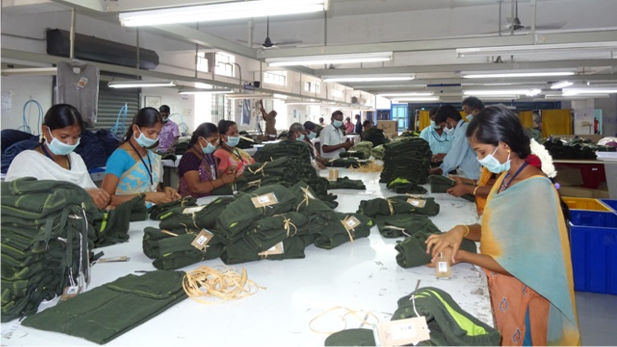 A photo of factory workers packing orders at an ethical factory in India.