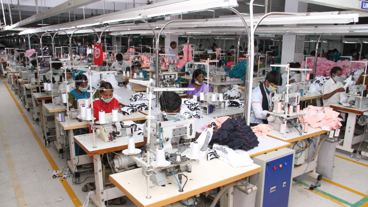 A photo of factory workers sewing at an ethical factory in India.