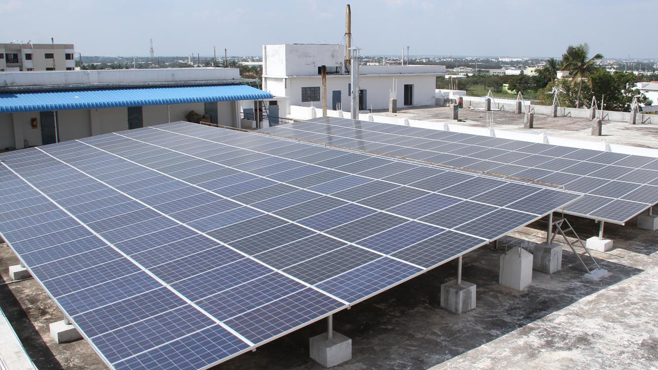 A photo of solar panels outside an ethical factory in India.