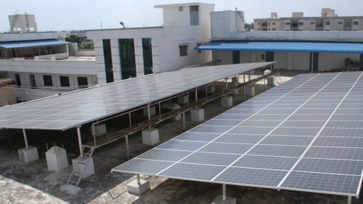 A photo of solar panels outside an ethical factory in India.