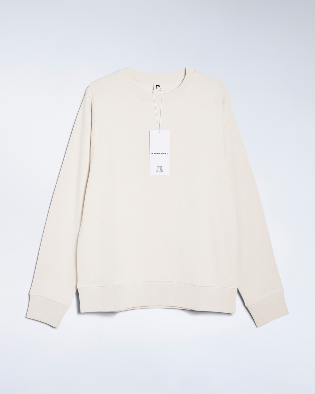 A flatlay of a natural coloured, organic cotton sweatshirt.