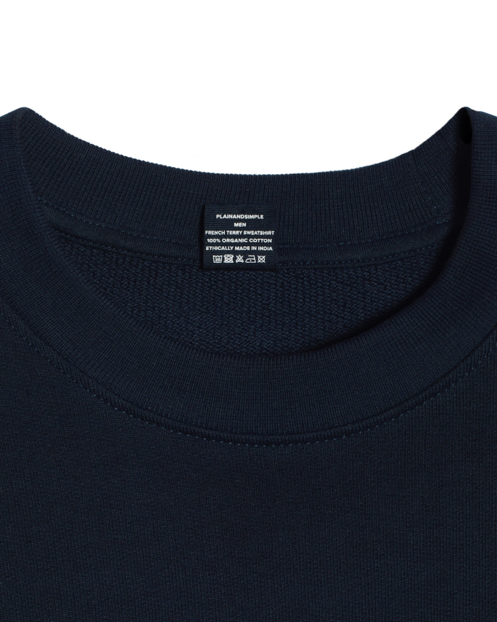 A close up of an neck label in a men's navy organic cotton sweatshirt.