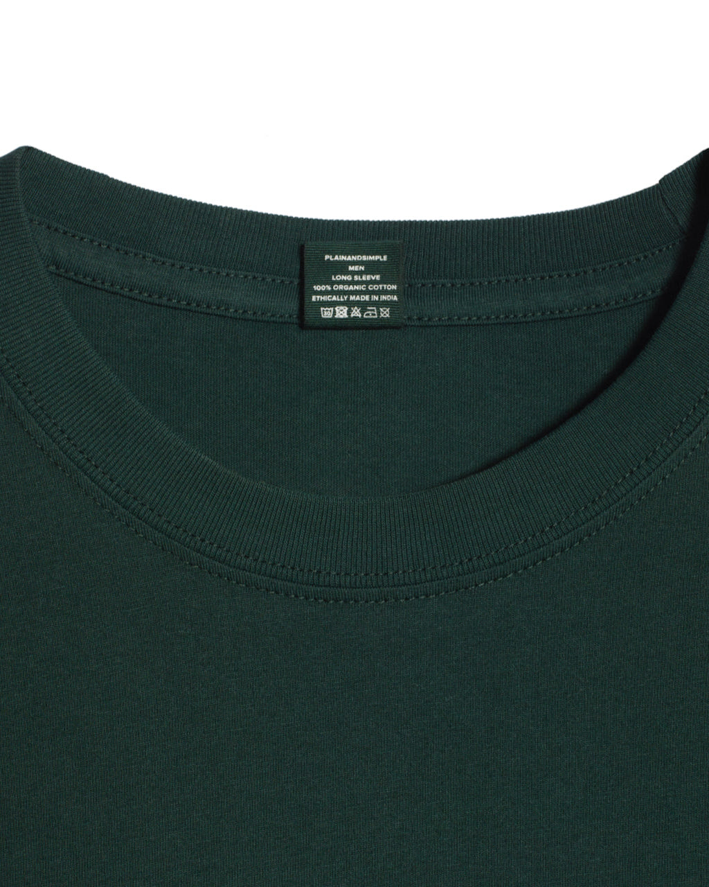 A close up of a neck label in a men's green long sleeve crew neck organic cotton t shirt.