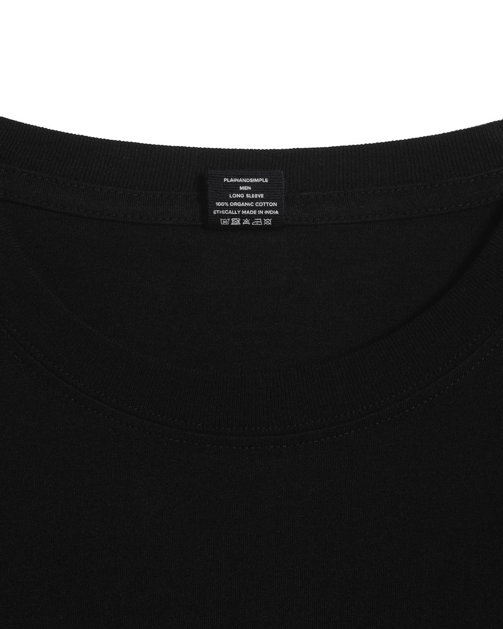 A close up of an neck label in a men's black long sleeve crew neck organic cotton t shirt.