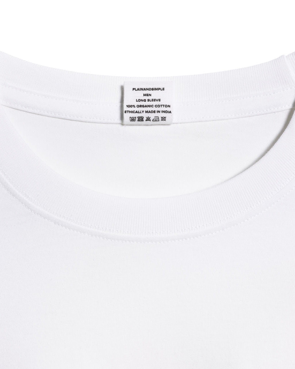 A close up of an neck label in a men's white long sleeve crew neck organic cotton t shirt.