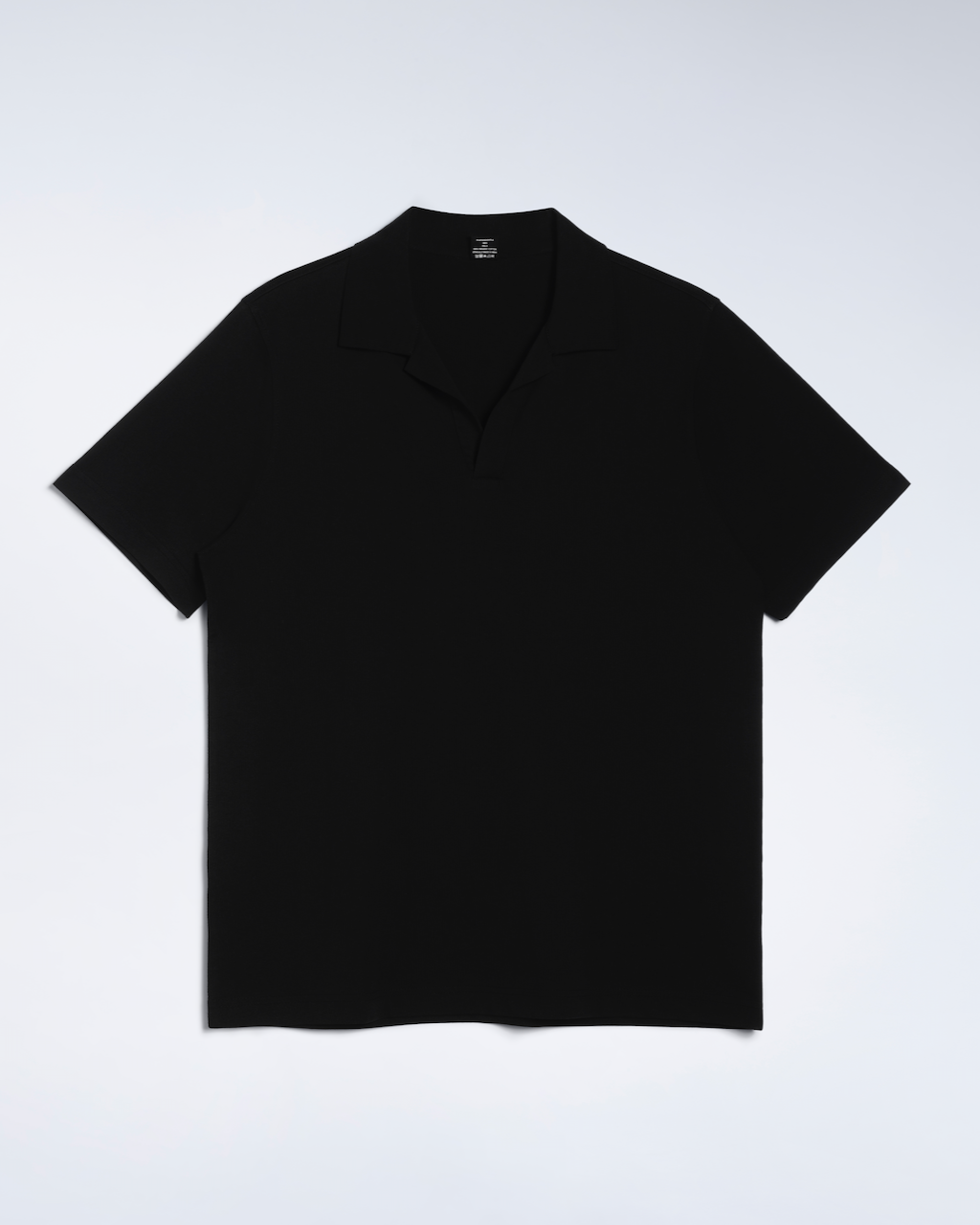 A flatly of a black, open neck, organic cotton polo shirt.