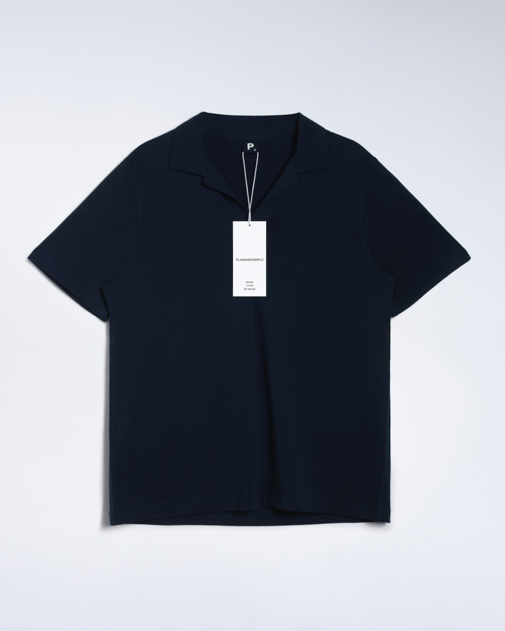 A flatly of a navy, open neck, organic cotton polo shirt.