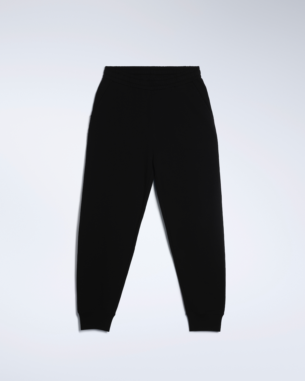 A flatlay of a pair of black, organic cotton joggers.