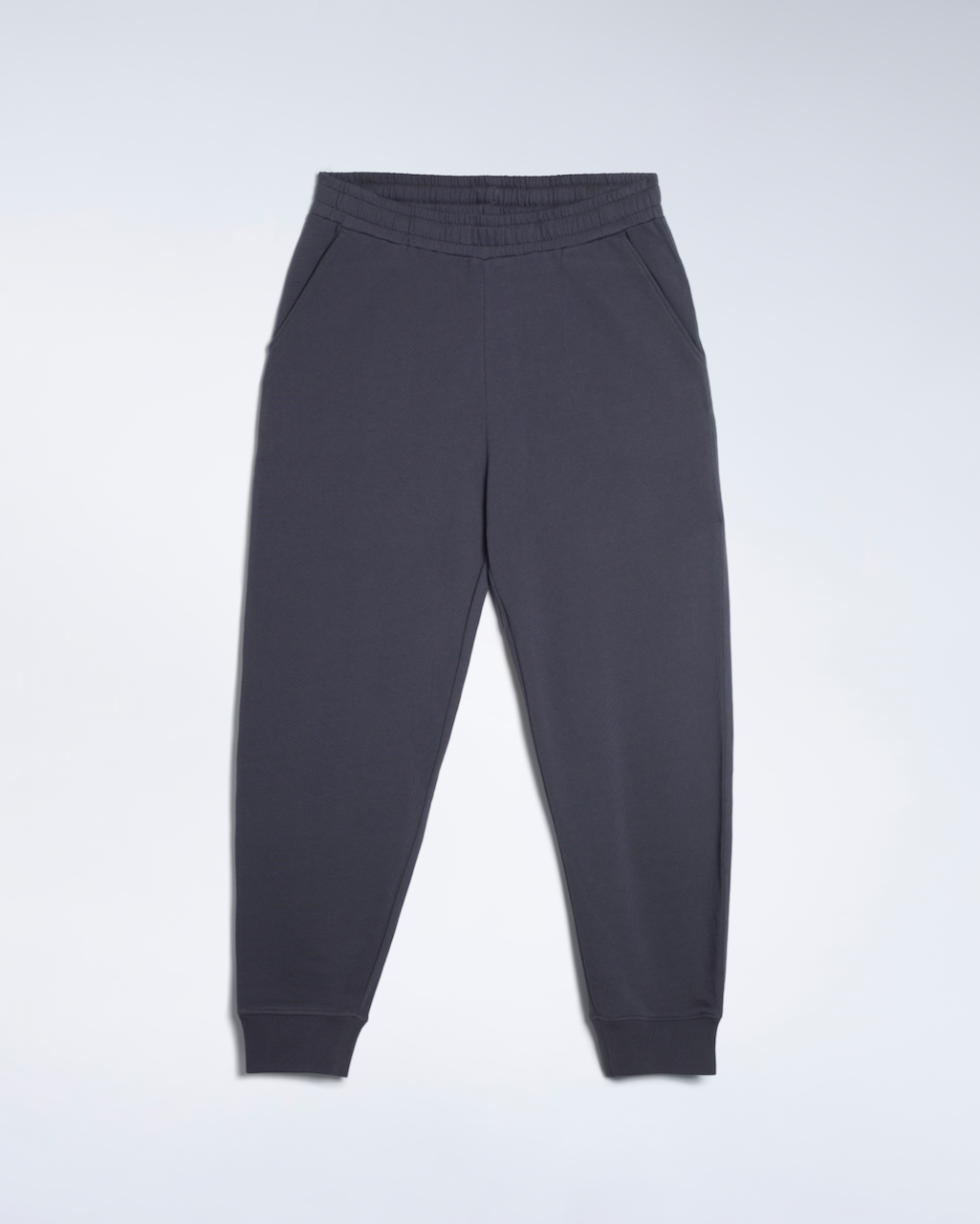 A flatlay of a pair of dark grey, organic cotton joggers.