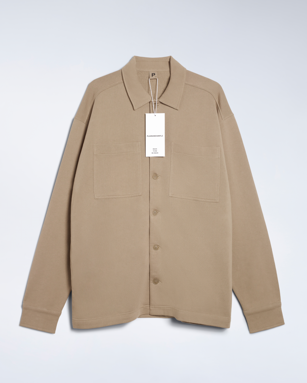 A flatlay of a beige, organic cotton overshirt.