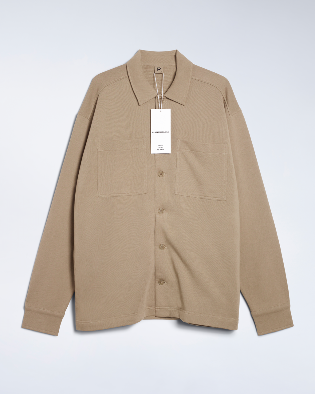 A flatlay of a beige, organic cotton overshirt.