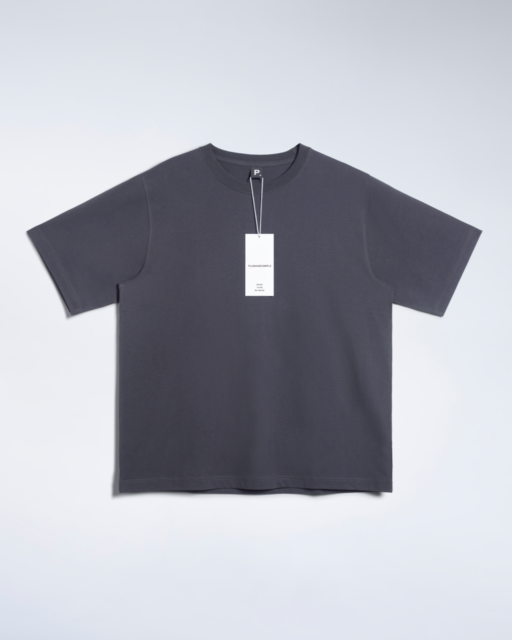 A flatlay of a dark grey, oversized, heavyweight, organic cotton t shirt.