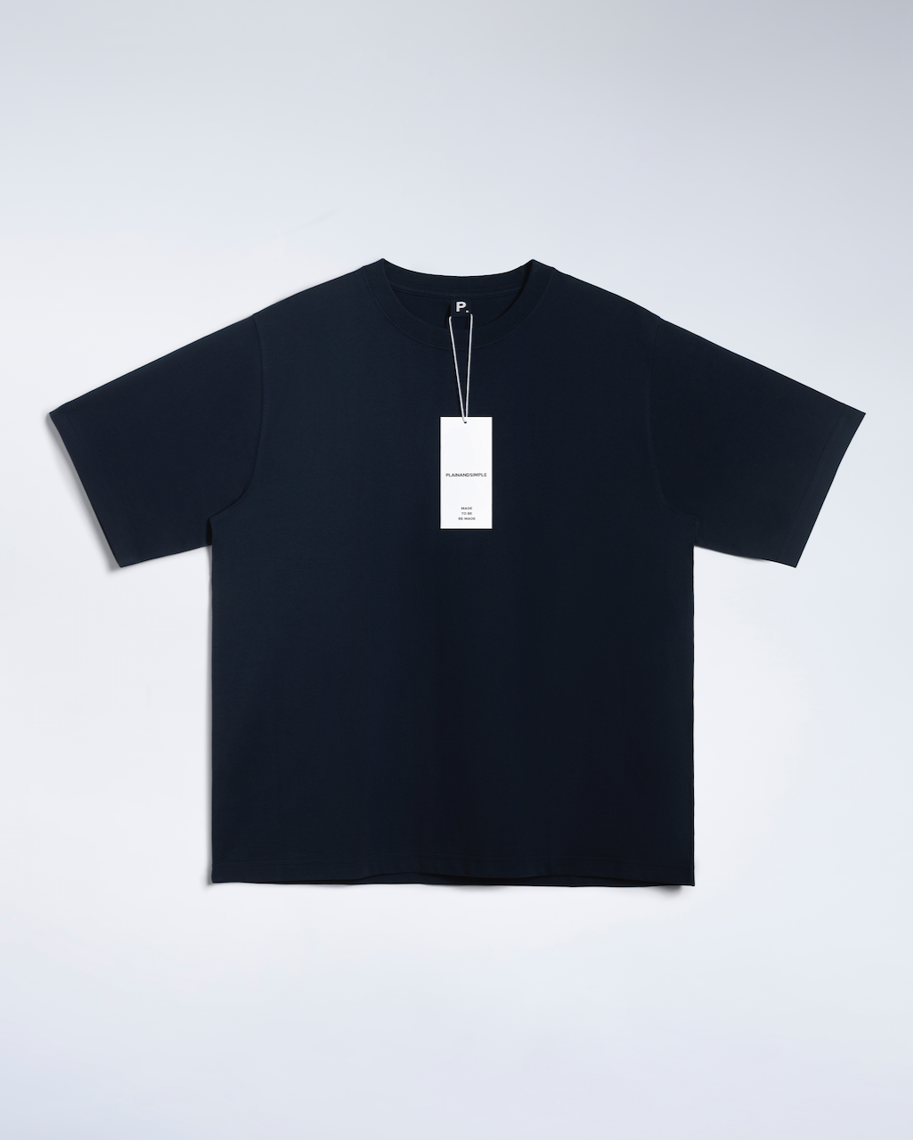 A flatlay of a navy, oversized, heavyweight, organic cotton t shirt.