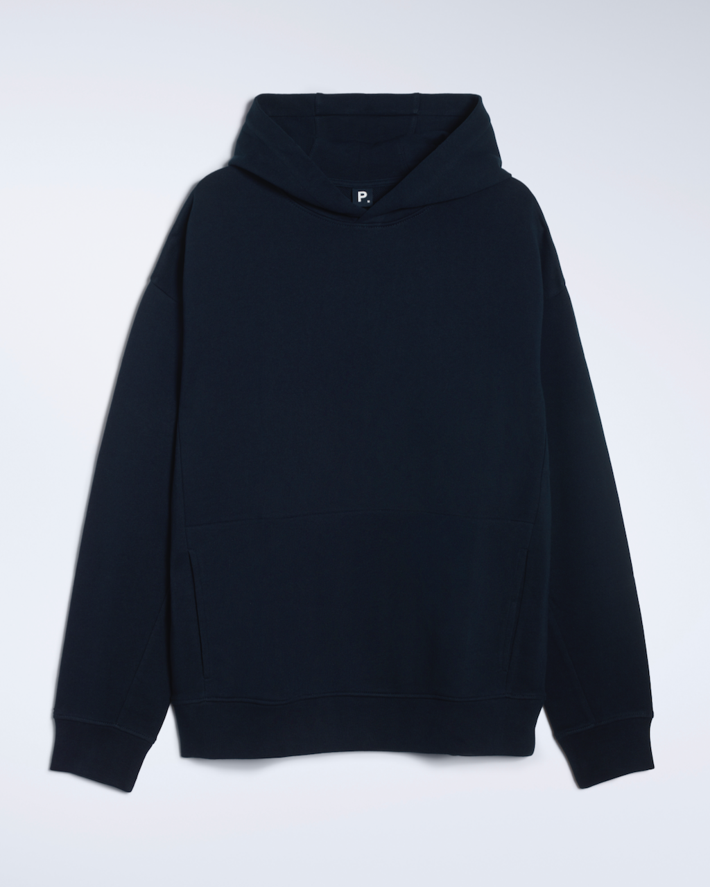 A flatlay of a navy, oversized, organic cotton hoodie.