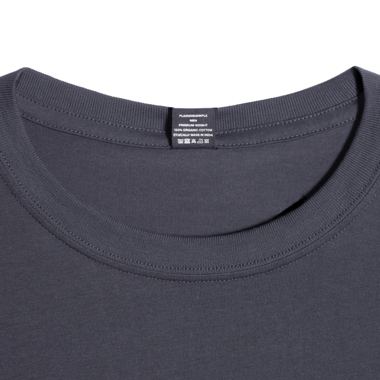 A close up of a neck label in a men's dark grey short sleeve crew neck organic cotton t shirt.