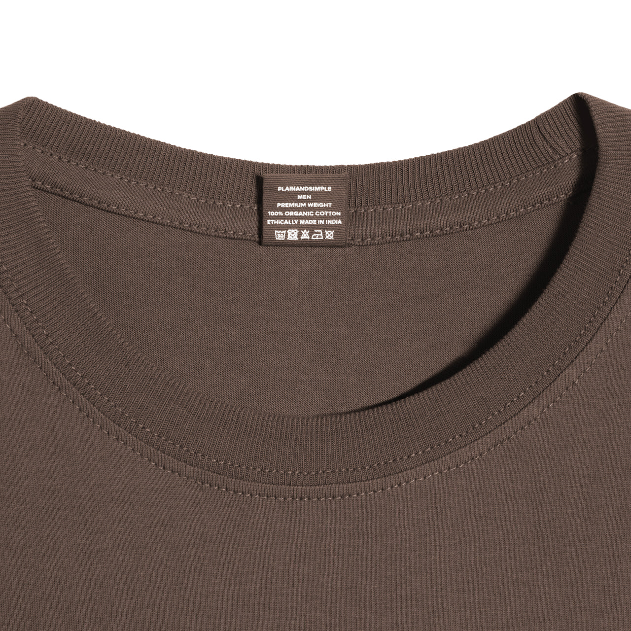 A close up of a neck label in a men's dark khaki short sleeve crew neck organic cotton t shirt.
