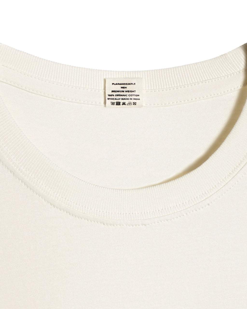A close up of a neck label in a men's ecru short sleeve crew neck organic cotton t shirt.
