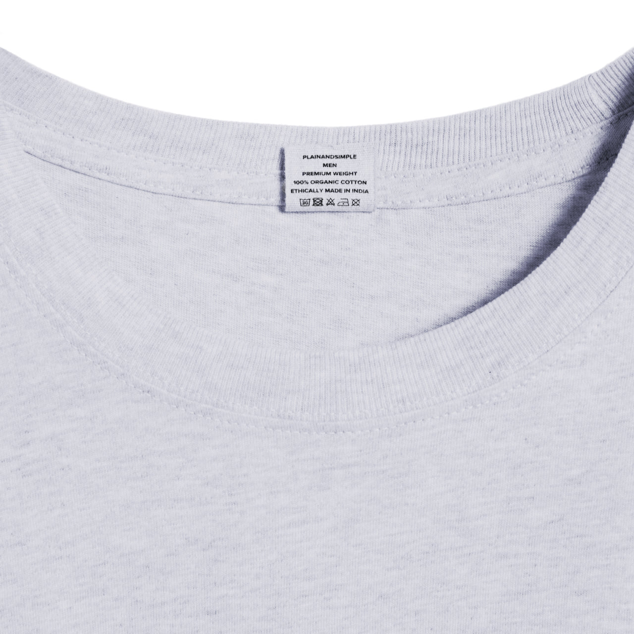 A close up of a neck label in a men's grey short sleeve crew neck organic cotton t shirt.