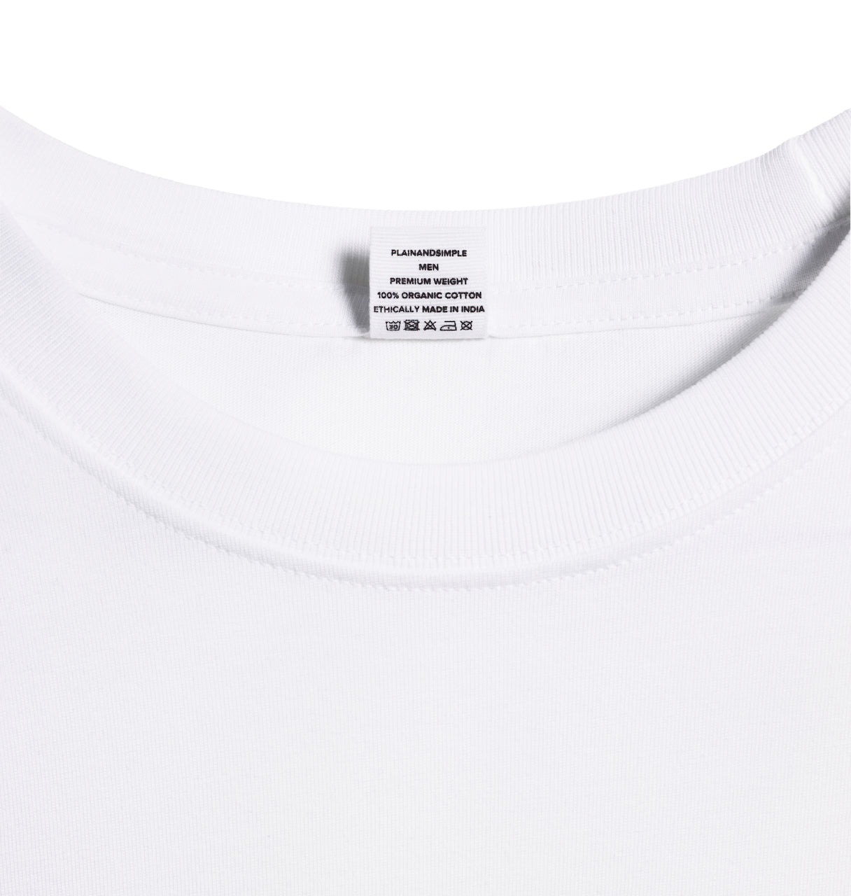 A close up of a neck label in a men's white short sleeve crew neck organic cotton t shirt.