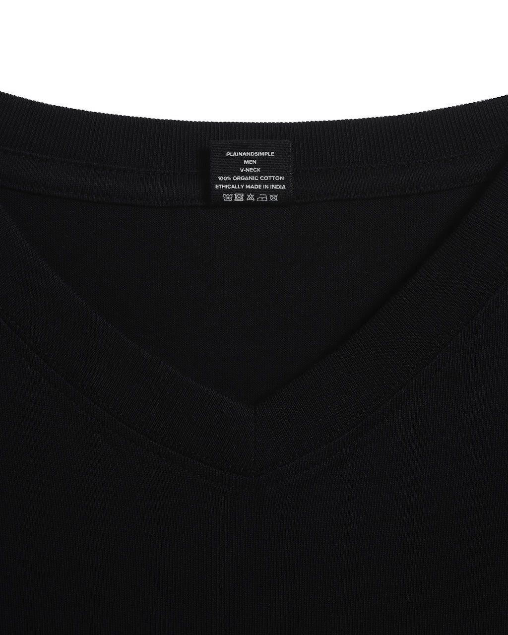 A close up of an neck label in a men's black short sleeve v neck organic cotton t shirt.