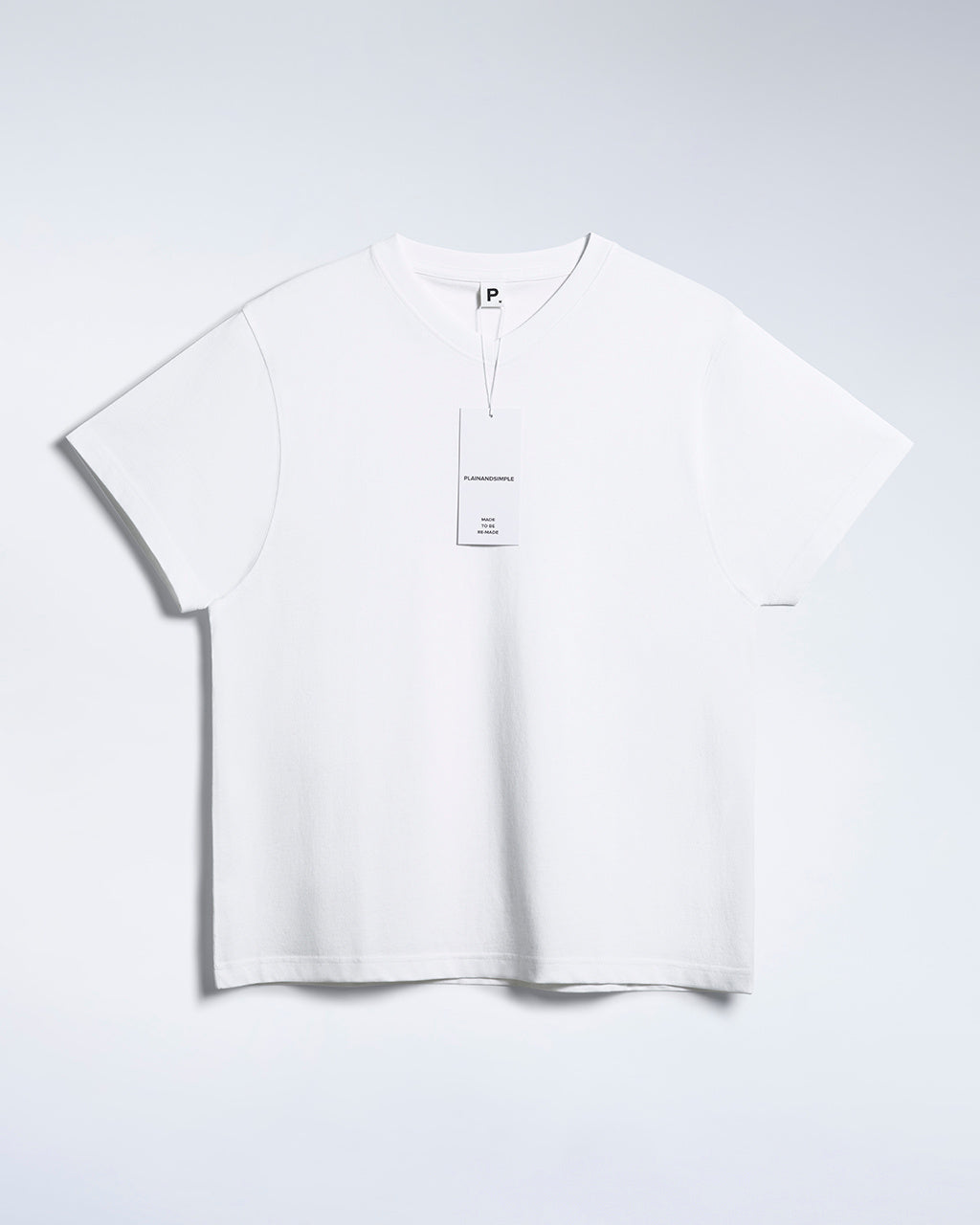 A flatlay of a men's white, premium weight, organic cotton, v neck t shirt.