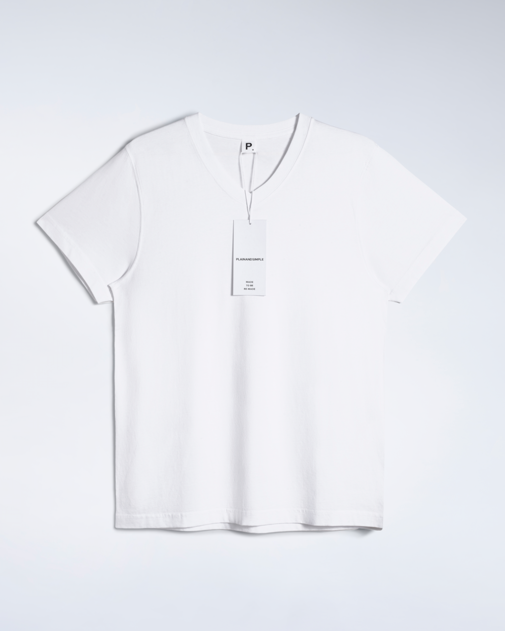 A flatlay of a white, organic cotton, v neck t shirt.
