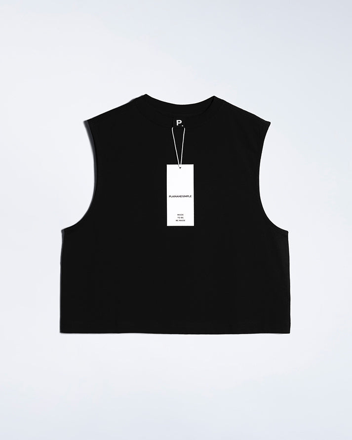 A flatlay of a women's plain black sleeveless organic cotton tank top.