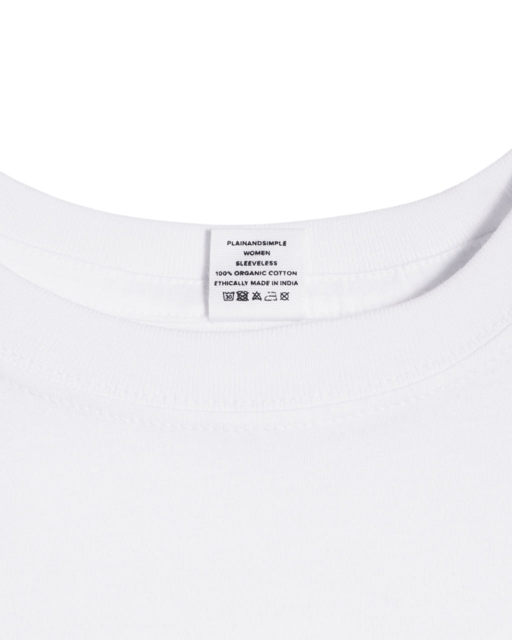 A close up of a neck label in a women's white sleeveless organic cotton crew neck tank top.