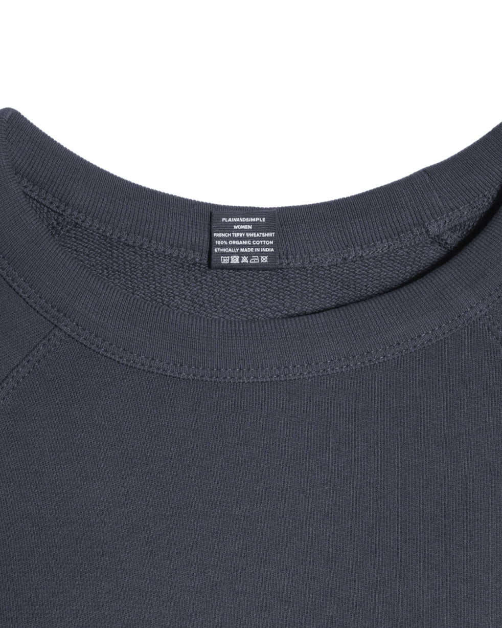 A close up of an neck label in a women's dark grey organic cotton sweatshirt.