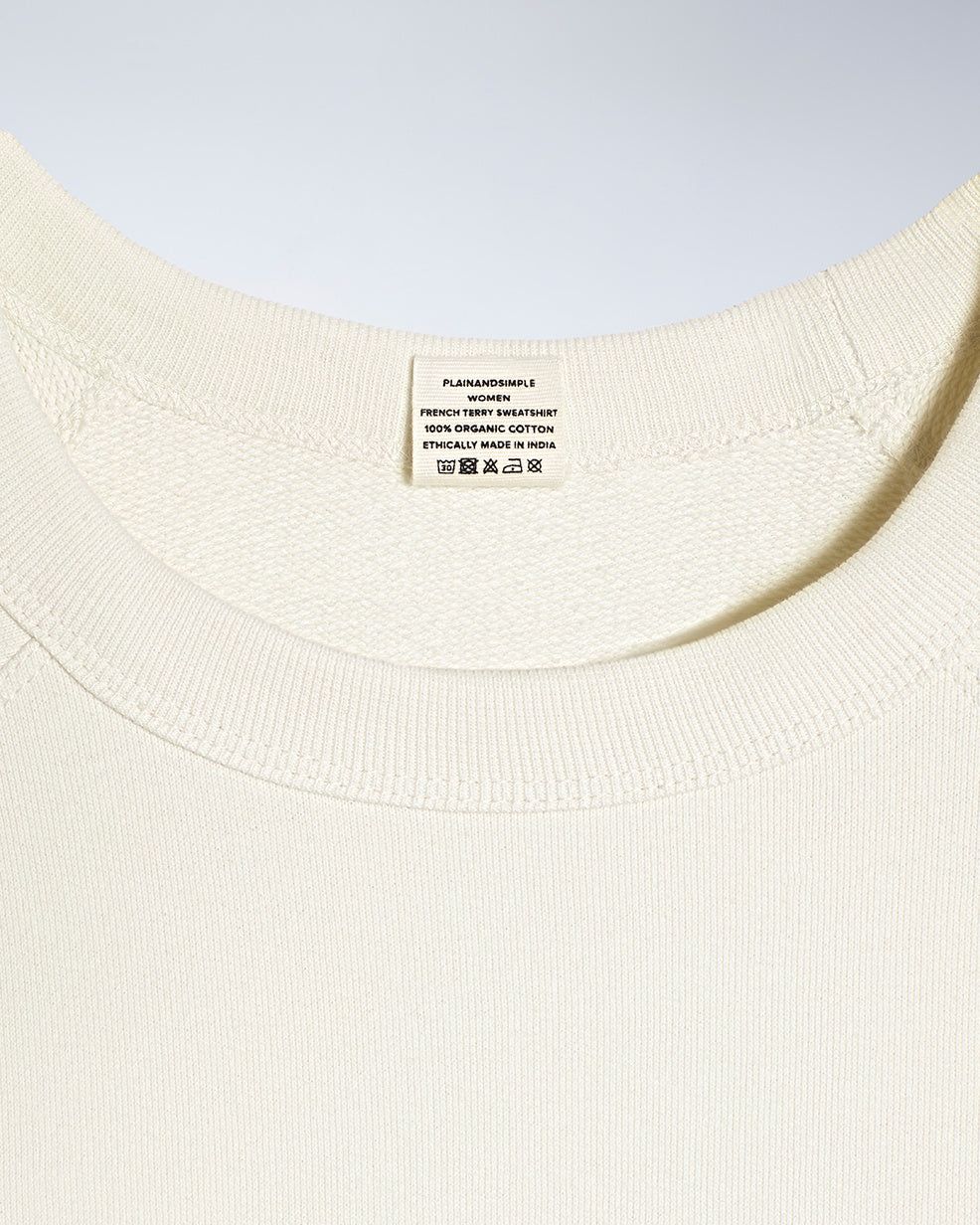 A close up of an neck label in a women's ecru organic cotton sweatshirt.