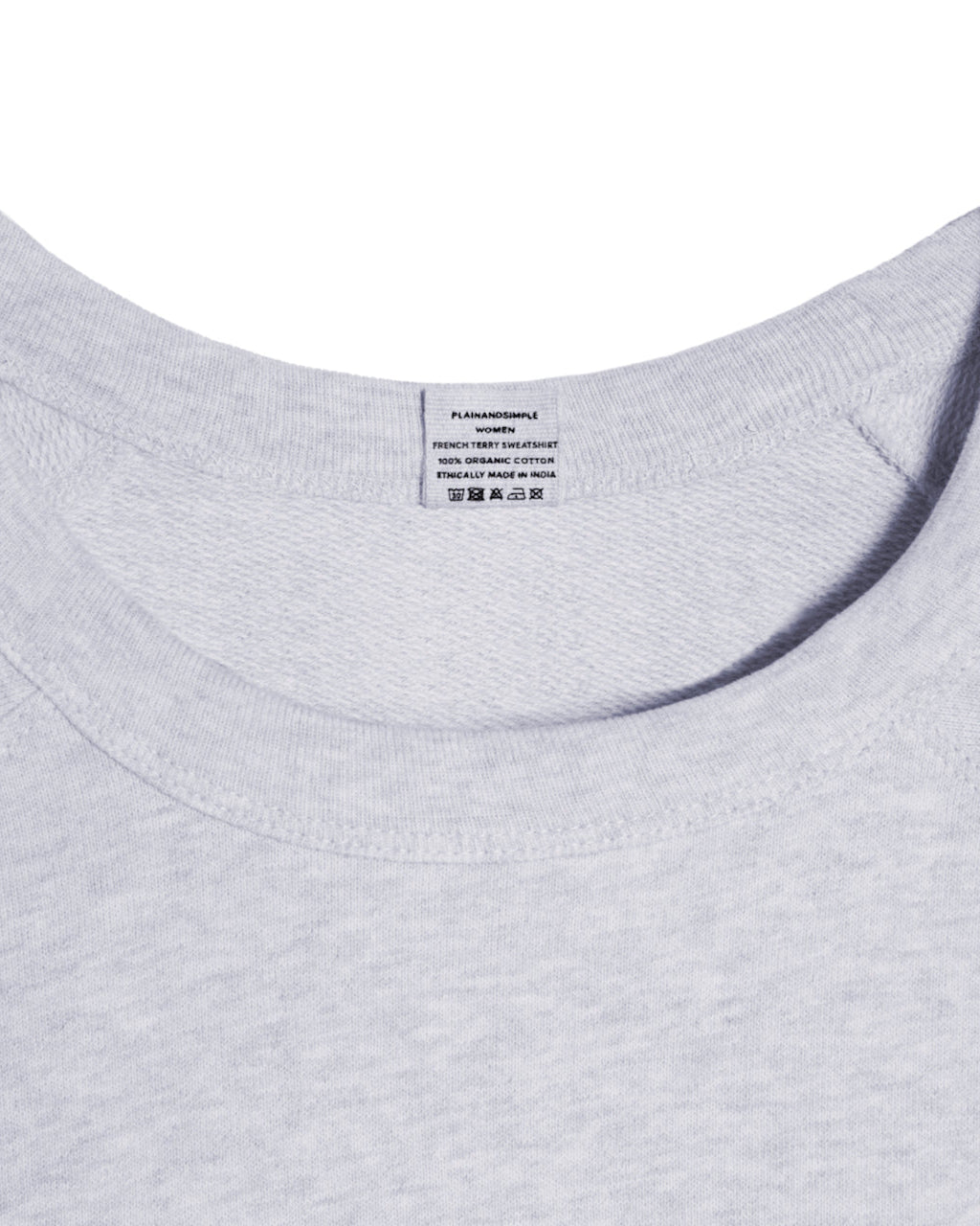 A close up of an neck label in a women's grey organic cotton sweatshirt.