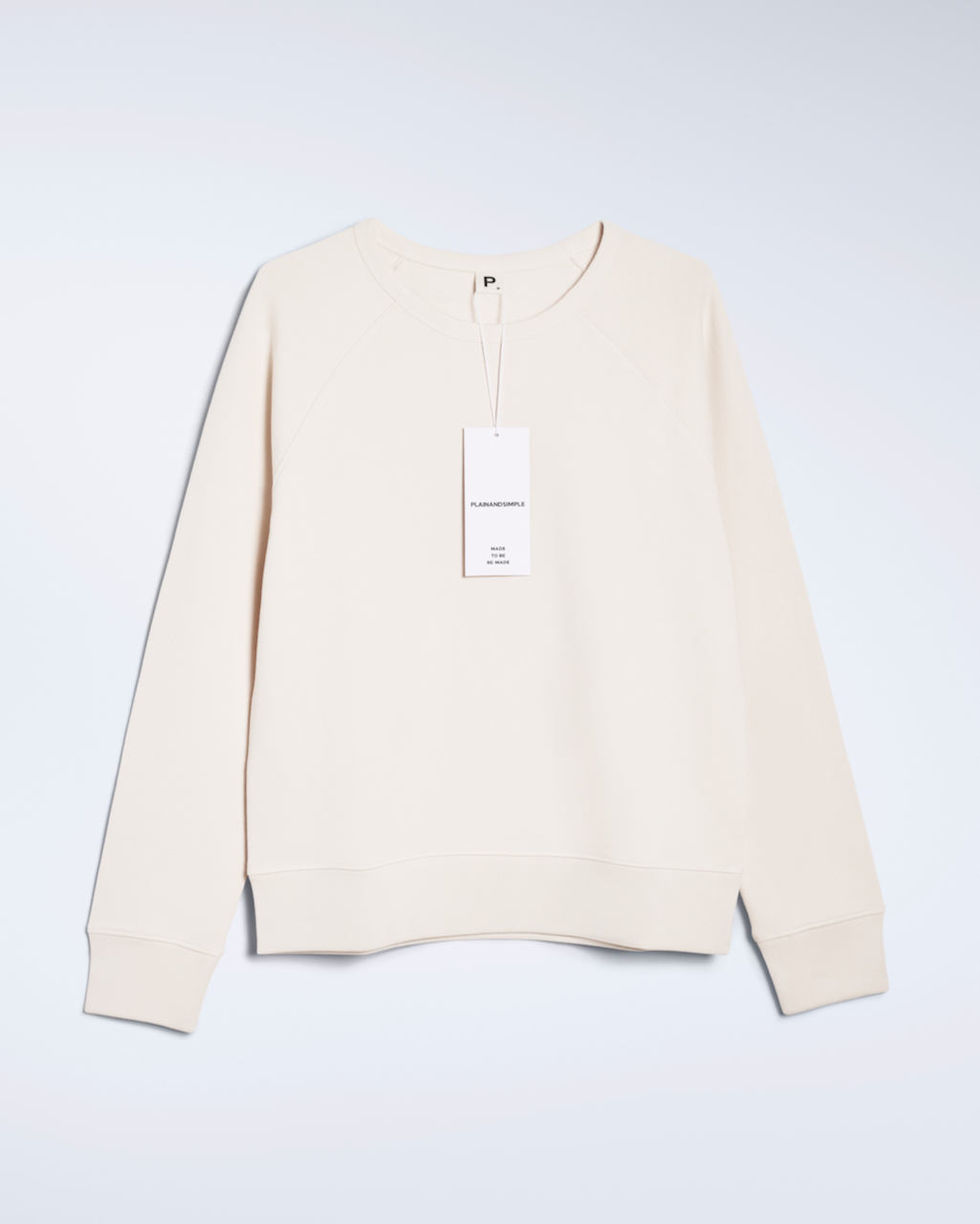 A flatlay of a natural coloured, organic cotton sweatshirt.