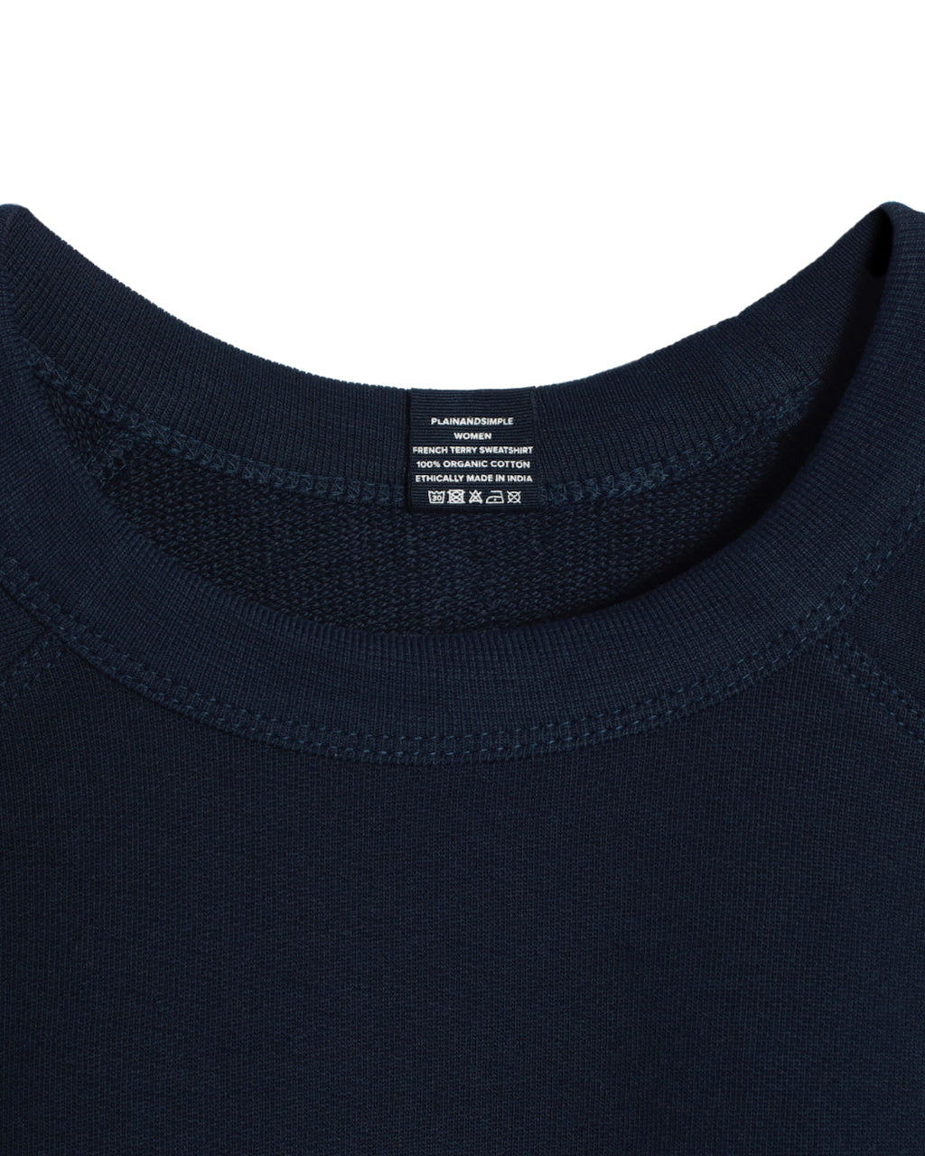 A close up of an neck label in a women's navy organic cotton sweatshirt.