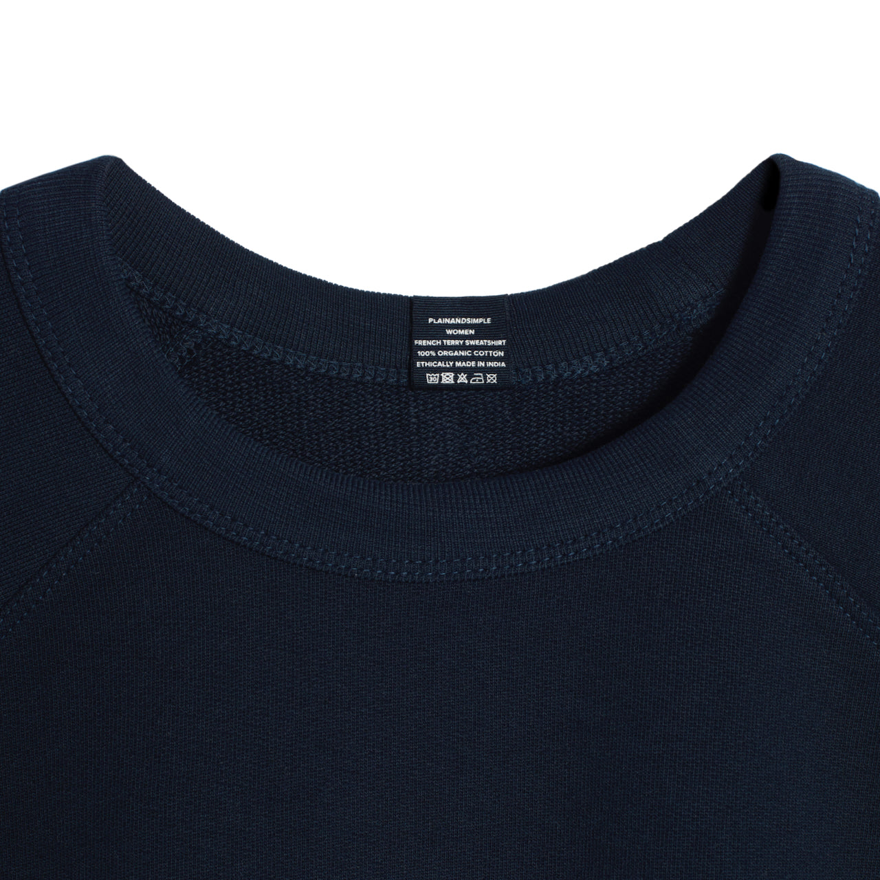 A close up of an neck label in a women's navy organic cotton sweatshirt.