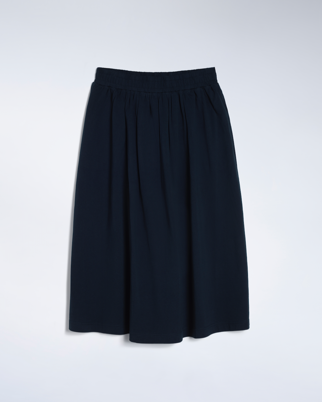 A flatlay of an navy, organic cotton midi skirt.