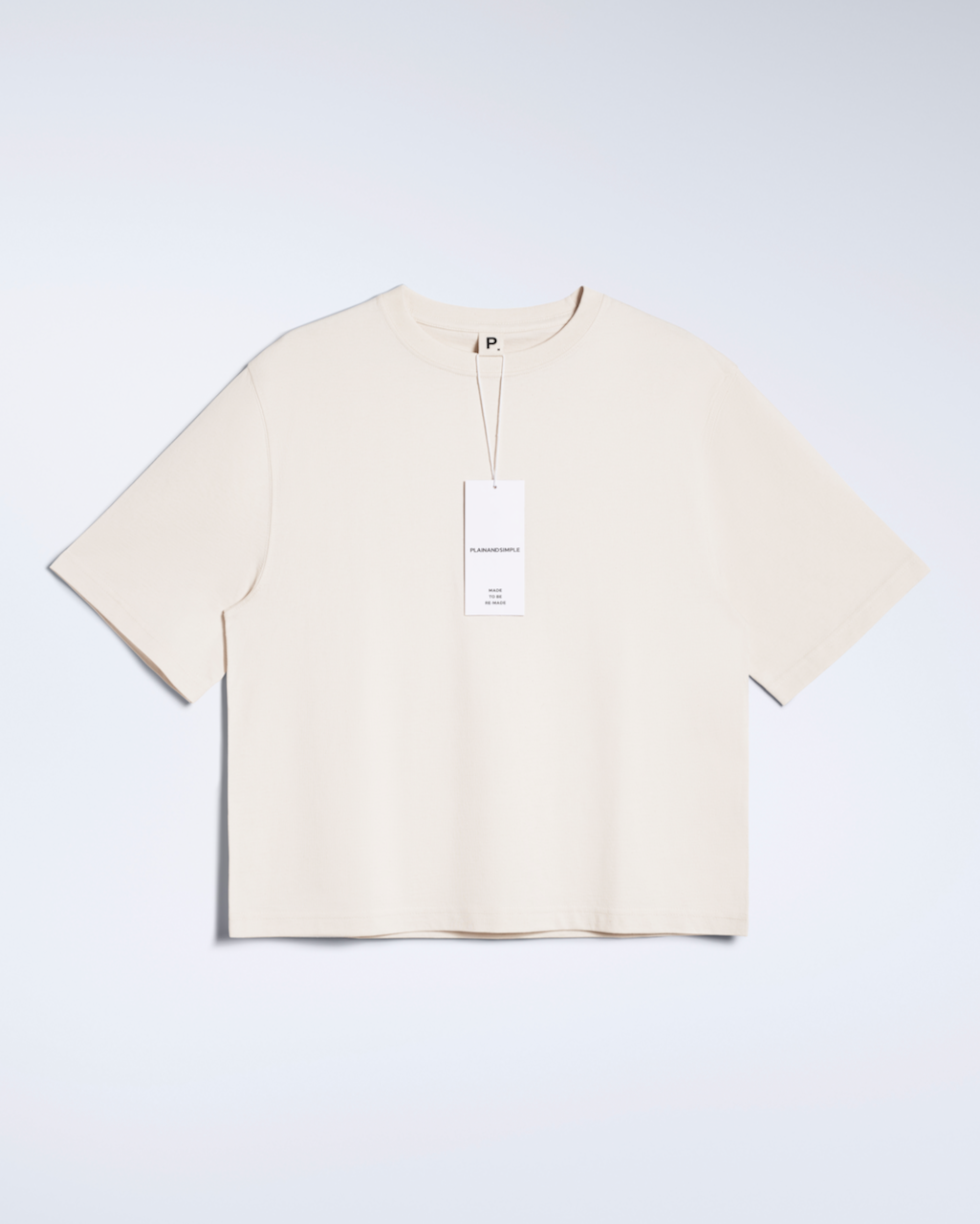 A flatlay of a natural coloured, heavyweight, boxy organic cotton t shirt.